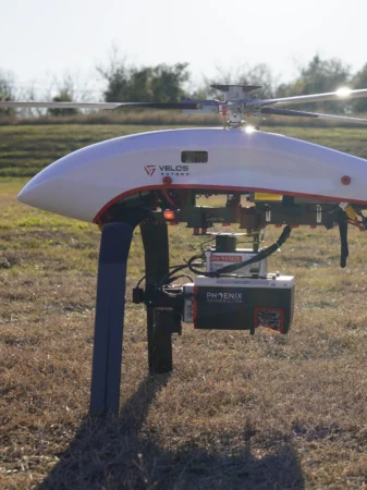 A Phoenix LiDAR is attached to a Velos V3 UAV helicopter.