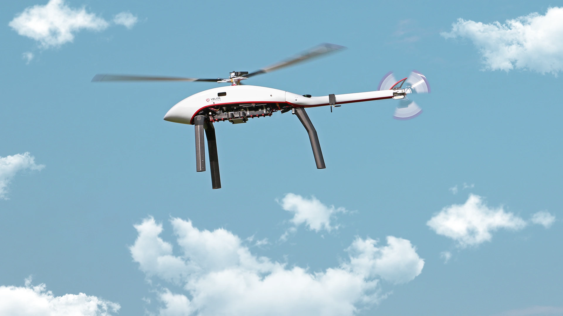 elos V3 UAV helicopter flying under the blue sky during test flight